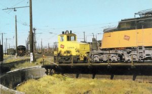 postcard-chicago-trains-milwaukee-road-shop-switcher-little-joe-diesel-engine-pulled-from-roundh.jpg
