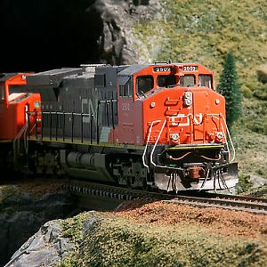 CN 2502 comes out of the tunnel leading the train