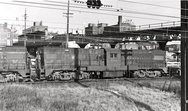 BS24m consist passes under the P&W Trestle, in 1958 Norristown, PA.jpg