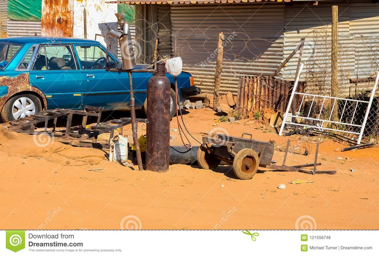johannesburg-south-africa-september-small-informal-hawker-repairing-vehicle-exhausts-street-ur...jpg