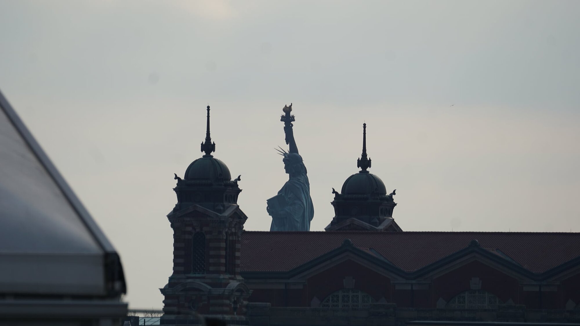 Lady Liberty and Ellis Island spires from CNJ Terminal.jpg