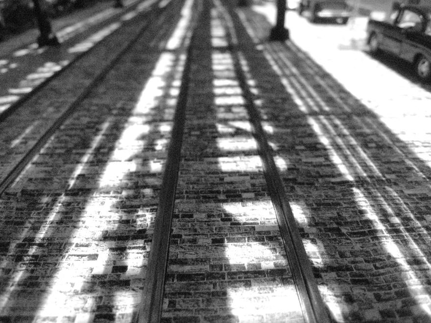 local-track-shadows-on-cobblestone-street_5440941604_o.jpg
