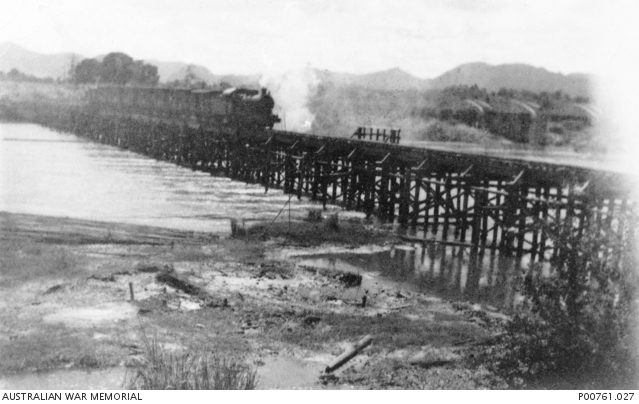 Train crossing the wooden bridge which spanned the Mae Klong River (renamed Kwai Yai River in ...JPG