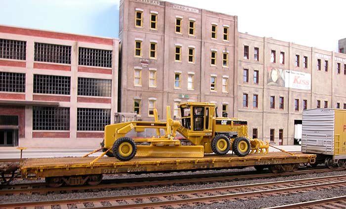 Caterpillar on a flat car