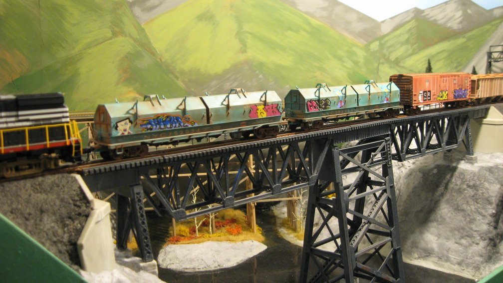 weathered_coil_cars_on_viaduct.jpg